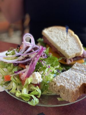 Sandwich served with a vegetable salad